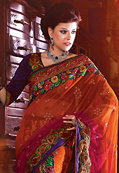 Let your personality articulate for you with this amazing embroidered saree. This rust, pink and green net and faux georgette lehenga style saree have beautiful embroidery patch work which is embellished with resham, zari, stone and beaded lace work. Fabulous designed embroidery gives you an ethnic look and increasing your beauty. Contrasting dark purple blouse is available. Slight Color variations are possible due to differing screen and photograph resolutions.