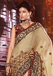 The evolution of style species collection spells pure femininity. This light fawn crepe jacquard saree have beautiful embroidery patch work which is embellished with resham, zari, sequins and stone work. Fabulous designed embroidery gives you an ethnic look and increasing your beauty. Contrasting maroon blouse is available. Slight Color variations are possible due to differing screen and photograph resolutions.