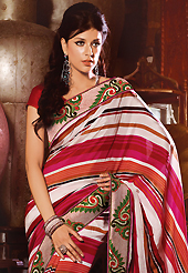 Try out this year top trend, glowing, bold and natural collection. This off white and magenta art silk saree have beautiful embroidery patch work which is embellished with resham work. Fabulous designed embroidery gives you an ethnic look and increasing your beauty. Contrasting red blouse is available. Slight Color variations are possible due to differing screen and photograph resolutions.