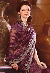 Ultimate collection of embroidery sarees with fabulous style. This dark burgundy net lehenga style saree have beautiful embroidery patch work which is embellished with resham, zari and sequins work. Fabulous designed embroidery gives you an ethnic look and increasing your beauty. Matching blouse is available. Slight Color variations are possible due to differing screen and photograph resolutions.