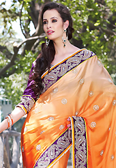 Dreamy variation on shape and forms compliment your style with tradition. This shaded orange faux satin georgette saree have beautiful embroidery patch work which is embellished with resham, zari, stone, beads and lace work. Fabulous designed embroidery gives you an ethnic look and increasing your beauty. Contrasting purple art silk blouse is available. Slight Color variations are possible due to differing screen and photograph resolutions.