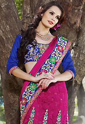 It is color this season and bright shaded suits are really something that is totally in vogue. This shaded dark pink faux georgette jacquard and net lehenga style saree have beautiful embroidery patch work which is embellished with resham, zari and stone work. Fabulous designed embroidery gives you an ethnic look and increasing your beauty. Contrasting blue art silk blouse is available. Slight Color variations are possible due to differing screen and photograph resolutions.