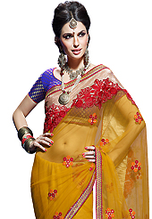 Exquisite combination of color, fabric can be seen here. This mustard net and faux chiffon saree have beautiful embroidery patch work which is embellished with resham, zari, stone and beads work. Fabulous designed embroidery gives you an ethnic look and increasing your beauty. Contrasting purple brocade blouse is available. Slight Color variations are possible due to differing screen and photograph resolutions.