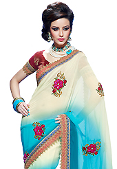 The fascinating beautiful subtly garment with lovely patterns. This cream and blue faux chiffon saree have beautiful embroidery patch work which is embellished with resham, zari, stone and lace work. Fabulous designed embroidery gives you an ethnic look and increasing your beauty. Contrasting maroon brocade blouse is available. Slight Color variations are possible due to differing screen and photograph resolutions.