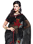 Take a look on the changing fashion of the season. This black and off white net and faux georgette saree have beautiful embroidery patch work which is embellished with resham and sequins work. Fabulous designed embroidery gives you an ethnic look and increasing your beauty. Matching blouse is available. Slight Color variations are possible due to differing screen and photograph resolutions.