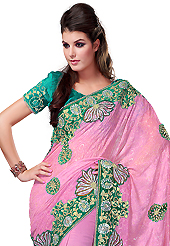 An occasion wear perfect is ready to rock you. This pink shimmer faux georgette have beautiful embroidery patch work which is embellished with resham, zari, sequins and stone work. Fabulous designed embroidery gives you an ethnic look and increasing your beauty. Contrasting sea green blouse is available. Slight Color variations are possible due to differing screen and photograph resolutions.