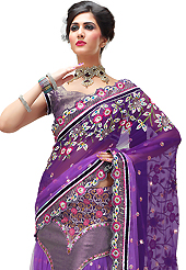 Try out this year top trend, glowing, bold and natural collection. This shaded purple net and brocade lehenga style saree have beautiful embroidery patch work which is embellished with resham, zari, sequins, stone and beads work. Fabulous designed embroidery gives you an ethnic look and increasing your beauty. Matching blouse is available. Slight Color variations are possible due to differing screen and photograph resolutions.