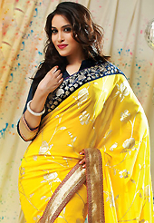 Take a look on the changing fashion of the season. This yellow faux chiffon saree have beautiful embroidery patch work which is embellished with resham and zari work. Fabulous designed embroidery gives you an ethnic look and increasing your beauty. Contrasting dark navy blue blouse is available. Slight Color variations are possible due to differing screen and photograph resolutions.