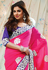 A desire that evokes a sense of belonging with a striking details. This dark pink faux chiffon saree have beautiful embroidery patch work which is embellished with resham and zari work. Fabulous designed embroidery gives you an ethnic look and increasing your beauty. Contrasting dark purple blouse is available. Slight Color variations are possible due to differing screen and photograph resolutions.