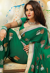Your search for elegant look ends here with this lovely saree. This dark green faux chiffon saree have beautiful embroidery patch work which is embellished with zari work. Fabulous designed embroidery gives you an ethnic look and increasing your beauty. Matching blouse is available. Slight Color variations are possible due to differing screen and photograph resolutions.