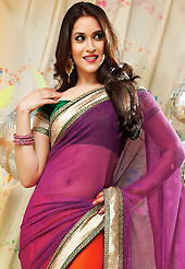 Let your personality articulate for you with this amazing embroidered saree. This purple and red net and faux crepe saree have beautiful embroidery patch work which is embellished with zari and lace work. Fabulous designed embroidery gives you an ethnic look and increasing your beauty. Contrasting green blouse is available. Slight Color variations are possible due to differing screen and photograph resolutions.