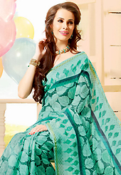 The traditional patterns used on this saree maintain the ethnic look. This beautiful light turquoise green super net saree is nicely designed with dot and leaf like print work. Beautiful print work on saree make attractive to impress all. It will enhance your personality and gives you a singular look. Matching blouse is available with this saree. Slight color variations are due to differing screen and photography resolution.