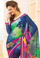 An occasion wear perfect is ready to rock you. This beautiful navy blue and magenta super net saree is nicely designed with flower, dots print and graceful patch border. Beautiful print work on saree make attractive to impress all. It will enhance your personality and gives you a singular look. Matching blouse is available with this saree. Slight color variations are due to differing screen and photography resolution.