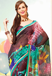 A desire that evokes a sense of belonging with a striking details. This beautiful dark brown and green super net saree is nicely designed with flower, dots print and graceful patch border. Beautiful print work on saree make attractive to impress all. It will enhance your personality and gives you a singular look. Matching blouse is available with this saree. Slight color variations are due to differing screen and photography resolution.