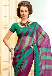 Keep the interest with this printed saree. This beautiful dark magenta and green super net saree is nicely designed with stripe, dots, polka dots print and graceful patch border. Beautiful print work on saree make attractive to impress all. It will enhance your personality and gives you a singular look. Matching blouse is available with this saree. Slight color variations are due to differing screen and photography resolution.