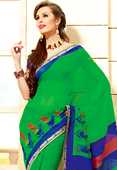 Style and trend will be at the peak of your beauty when you adorn this saree. This beautiful green and blue super net saree is nicely designed with paisley print and graceful patch border. Beautiful print work on saree make attractive to impress all. It will enhance your personality and gives you a singular look. Matching blouse is available with this saree. Slight color variations are due to differing screen and photography resolution.