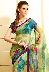Printed sarees are the best choice for a girl to enhance her feminine look. This beautiful green super net saree is nicely designed with floral, abstract print and graceful patch border. Beautiful print work on saree make attractive to impress all. It will enhance your personality and gives you a singular look. Contrasting dark blue blouse is available with this saree. Slight color variations are due to differing screen and photography resolution.