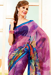 It is color this season and bright shaded suits are really something that is totally in vogue. This beautiful magenta super net saree is nicely designed with floral, abstract print and graceful patch border. Beautiful print work on saree make attractive to impress all. It will enhance your personality and gives you a singular look. Contrasting dark blue blouse is available with this saree. Slight color variations are due to differing screen and photography resolution.