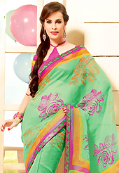 Dreamy variation on shape and forms compliment your style with tradition. This beautiful light green super net saree is nicely designed with floral print and graceful patch border. Beautiful print work on saree make attractive to impress all. It will enhance your personality and gives you a singular look. Contrasting pink blouse is available with this saree. Slight color variations are due to differing screen and photography resolution.