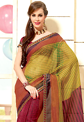 The most radiant carnival of style and beauty. This beautiful maroon and mustard super net saree is nicely designed with geometric print and graceful patch border. Beautiful print work on saree make attractive to impress all. It will enhance your personality and gives you a singular look. Matching blouse is available with this saree. Slight color variations are due to differing screen and photography resolution.