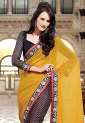 The most beautiful refinements for style and tradition. This mustard and black faux georgette saree have beautiful embroidery patch work which is embellished with zari and beads work. Fabulous designed embroidery gives you an ethnic look and increasing your beauty. Matching black blouse is available. Slight Color variations are possible due to differing screen and photograph resolutions.