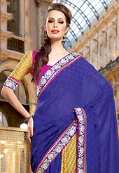 Let your personality articulate for you with this amazing embroidered saree. This dark blue and yellow dupion jacquard saree have beautiful embroidery patch work which is embellished with resham and zari work. Fabulous designed embroidery gives you an ethnic look and increasing your beauty. Contrasting pink and yellow blouse is available. Slight Color variations are possible due to differing screen and photograph resolutions.