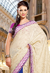 Take a look on the changing fashion of the season. This cream and blue dupion and faux georgette saree have beautiful embroidery patch work which is embellished with resham work. Fabulous designed embroidery gives you an ethnic look and increasing your beauty. Contrasting magenta blouse is available. Slight Color variations are possible due to differing screen and photograph resolutions.