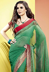 Get ready to sizzle all around you by sparkling saree. This beautiful green faux georgette saree is nicely designed with abstract print and graceful patch border. Beautiful print work on saree make attractive to impress all. It will enhance your personality and gives you a singular look. Matching blouse is available with this saree. Slight color variations are due to differing screen and photography resolution.