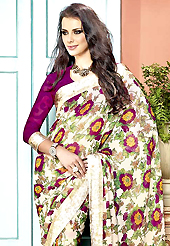Welcome to the new era of Indian fashion wear. This beautiful cream and dark magenta faux georgette saree is nicely designed with flower print and graceful patch border. Beautiful print work on saree make attractive to impress all. It will enhance your personality and gives you a singular look. Matching blouse is available with this saree. Slight color variations are due to differing screen and photography resolution.