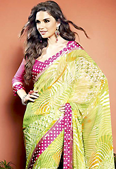 An endearing splash oh colors look gorgeous tridimensional charm. This beautiful light green and off white faux georgette saree is nicely designed with abstract, dots print and graceful patch border. Beautiful print work on saree make attractive to impress all. It will enhance your personality and gives you a singular look. Contrasting dark pink blouse is available with this saree. Slight color variations are due to differing screen and photography resolution.
