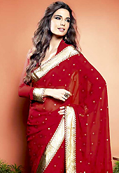 Era with extension in fashion, style, Grace and elegance have developed grand love affair with this ethnical wear. This beautiful dark red faux georgette saree is nicely designed with gold print and graceful patch border. Beautiful print work on saree make attractive to impress all. It will enhance your personality and gives you a singular look. Matching blouse is available with this saree. Slight color variations are due to differing screen and photography resolution.