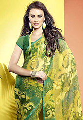 Take the fashion industry by storm in this beautiful printed saree. This beautiful yellow and green faux georgette saree is nicely designed with abstract print and graceful patch border. Beautiful print work on saree make attractive to impress all. It will enhance your personality and gives you a singular look. Matching blouse is available with this saree. Slight color variations are due to differing screen and photography resolution.