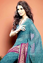 It is color this season and bright shaded suits are really something that is totally in vogue. This beautiful teal blue faux georgette saree is nicely designed with abstract, gold print and graceful patch border. Beautiful print work on saree make attractive to impress all. It will enhance your personality and gives you a singular look. Matching blouse is available with this saree. Slight color variations are due to differing screen and photography resolution.