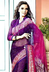An occasion wear perfect is ready to rock you. This beautiful shaded purple and pink faux georgette saree is nicely designed with bandhej, floral print and graceful patch border. Beautiful print work on saree make attractive to impress all. It will enhance your personality and gives you a singular look. Matching blouse is available with this saree. Slight color variations are due to differing screen and photography resolution.