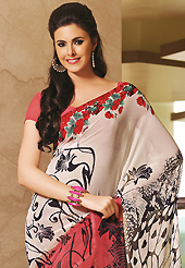 Keep the interest with this printed saree. This beautiful off white and red faux georgette saree is nicely designed with floral and abstract print work. Beautiful print work on saree make attractive to impress all. It will enhance your personality and gives you a singular look. Matching blouse is available with this saree. Slight color variations are due to differing screen and photography resolution.