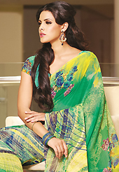 Get ready to sizzle all around you by sparkling saree. This beautiful green faux georgette saree is nicely designed with floral and abstract print work. Beautiful print work on saree make attractive to impress all. It will enhance your personality and gives you a singular look. Matching blouse is available with this saree. Slight color variations are due to differing screen and photography resolution.