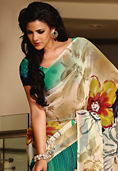 An endearing splash oh colors look gorgeous tridimensional charm. This beautiful cream and green faux georgette saree is nicely designed with flower and abstract print work. Beautiful print work on saree make attractive to impress all. It will enhance your personality and gives you a singular look. Matching blouse is available with this saree. Slight color variations are due to differing screen and photography resolution.