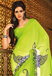 Take the fashion industry by storm in this beautiful printed saree. This beautiful parrot green and cream faux georgette saree is nicely designed with floral, paisley and stripe print work. Beautiful print work on saree make attractive to impress all. It will enhance your personality and gives you a singular look. Matching blouse is available with this saree. Slight color variations are due to differing screen and photography resolution.