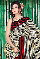 You can be sure that ethnic fashions selections of clothing are taken from the latest trend in today’s fashion. This beautiful cream, red and black faux crepe saree is nicely designed with paisley and stripe print work. Beautiful print work on saree make attractive to impress all. Matching black blouse is available with this saree. Slight color variations are due to differing screen and photography resolution.