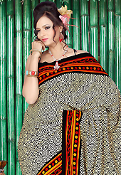 Ultimate collection of embroidered sarees with fabulous style. This beautiful cream, orange and black faux crepe saree is nicely designed with abstract and paisley print work. Beautiful print work on saree make attractive to impress all. Matching black blouse is available with this saree. Slight color variations are due to differing screen and photography resolution.