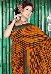 Take the fashion industry by storm in this beautiful printed saree. This beautiful orange and maroon faux crepe saree is nicely designed with floral and stripe print work. Beautiful print work on saree make attractive to impress all. Matching maroon blouse is available with this saree. Slight color variations are due to differing screen and photography resolution.