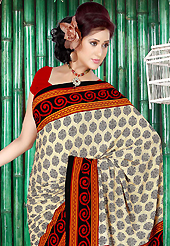 It is color this season and bright shaded suits are really something that is totally in vogue. This beautiful cream, black and orange faux crepe saree is nicely designed with floral and geometric print work. Beautiful print work on saree make attractive to impress all. Contrasting red blouse is available with this saree. Slight color variations are due to differing screen and photography resolution.