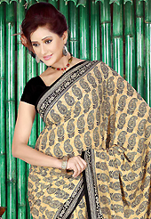 A desire that evokes a sense of belonging with a striking details. This beautiful dark cream and black faux crepe saree is nicely designed with paisley and floral print work. Beautiful print work on saree make attractive to impress all. Matching black blouse is available with this saree. Slight color variations are due to differing screen and photography resolution.