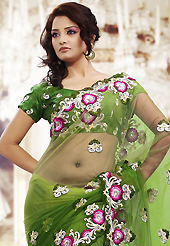 Let your personality articulate for you with this amazing embroidered saree. This shaded green net saree is nicely designed with embroidered patch work is done with resham and stone work. Beautiful embroidery work on saree make attractive to impress all. This saree gives you a modern and different look in fabulous style. Matching blouse is available. Slight color variations are possible due to differing screen and photograph resolution.