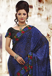 Welcome to the new era of Indian fashion wear. This dark blue brasso saree is nicely designed with embroidered patch work is done with resham and sequins work. Beautiful embroidery work on saree make attractive to impress all. This saree gives you a modern and different look in fabulous style. Contrasting black blouse is available. Slight color variations are possible due to differing screen and photograph resolution.