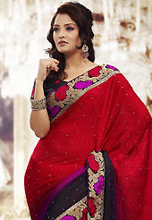 Style and trend will be at the peak of your beauty when you adorn this saree. This shaded red, black and purple chiffon jacquard saree is nicely designed with embroidered patch work is done with resham, zari and stone work. Beautiful embroidery work on saree make attractive to impress all. This saree gives you a modern and different look in fabulous style. Matching black blouse is available. Slight color variations are possible due to differing screen and photograph resolution.