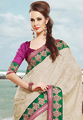 Try out this year top trend, glowing, bold and natural collection. This off white and maroon art silk and brocade saree is nicely designed with embroidered patch work is done with resham and zari work. Beautiful embroidery work on saree make attractive to impress all. This saree gives you a modern and different look in fabulous style. Matching blouse is available. Slight color variations are possible due to differing screen and photograph resolution.