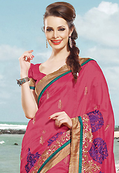 Ultimate collection of embroidered sarees with fabulous style. This dark pink satin saree is nicely designed with embroidered patch work is done with resham and zari work. Beautiful embroidery work on saree make attractive to impress all. This saree gives you a modern and different look in fabulous style. Matching blouse is available. Slight color variations are possible due to differing screen and photograph resolution.