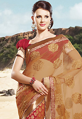 Embroidered sarees are the best choice for a girl to enhance her feminine look. This light brown and dark red net and brocade saree is nicely designed with embroidered patch work is done with resham, zari and stone work. Beautiful embroidery work on saree make attractive to impress all. This saree gives you a modern and different look in fabulous style. Matching blouse is available. Slight color variations are possible due to differing screen and photograph resolution.