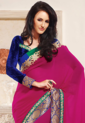 Let your personality articulate for you with this amazing embroidered saree. This dark pink faux georgette saree is nicely designed with embroidered patch work is done with resham and zari work. This saree gives you a modern and different look in fabulous style. Contrasting dark blue velvet blouse is available. Slight color variations are possible due to differing screen and photograph resolution.